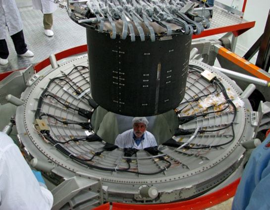 AMS-02 integration at CERN: Installation of the Inner Silicon Tracker inside the Magnet Vacuum Case 